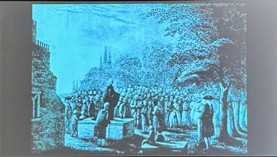 Wesley preaches in home parish from family gravesite